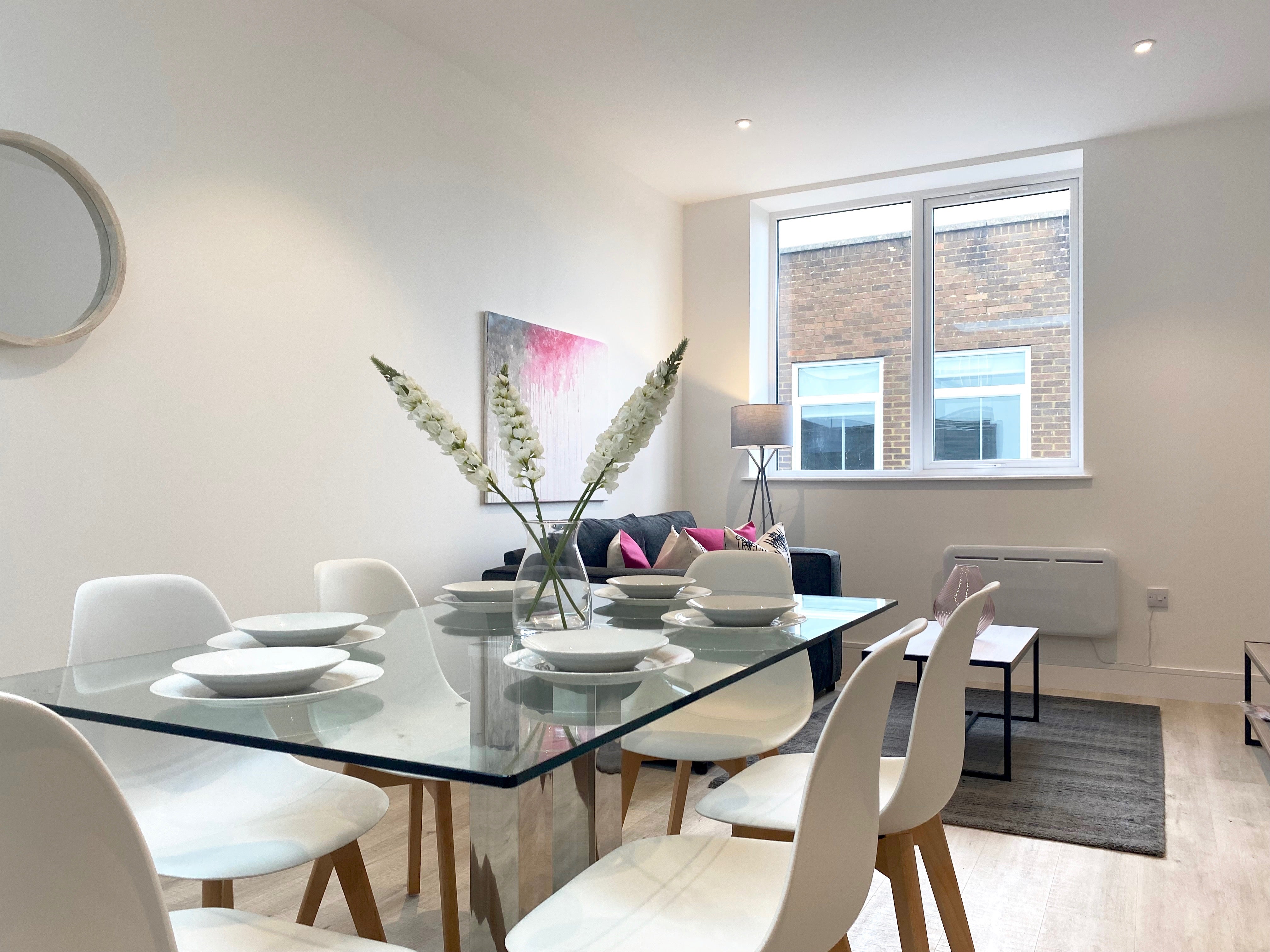 Glass dining table, white dining chairs