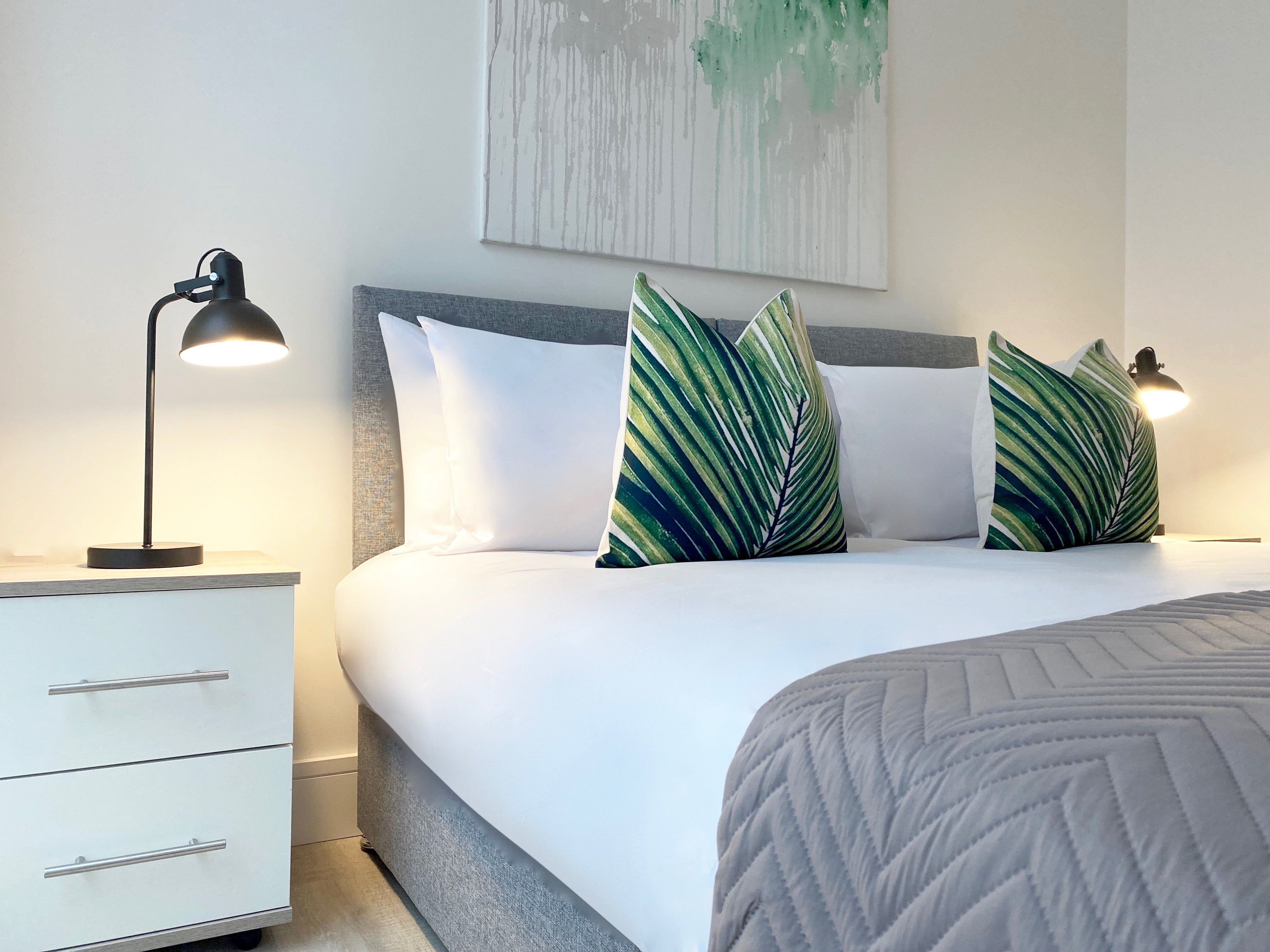 Green Cushions on Bed